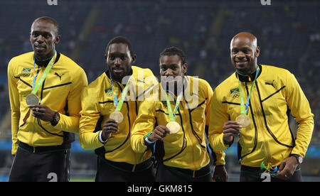 (From left to right) Jamaica's Usain Bolt, Nickel Ashmeade, Yohan Blake and Asafa Powell with their gold medals after victory in the the Men's 4 x 100m relay final at the Olympic Stadium on the fifteenth day of the Rio Olympic Games, Brazil. Stock Photo