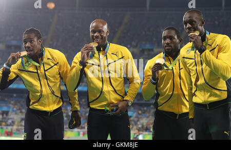 (From left to right) Jamaica's Yohan Blake, Asafa Powell, Nickel Ashmeade and Usain Bolt with their gold medals after victory in the the Men's 4 x 100m relay final at the Olympic Stadium on the fifteenth day of the Rio Olympic Games, Brazil. Stock Photo