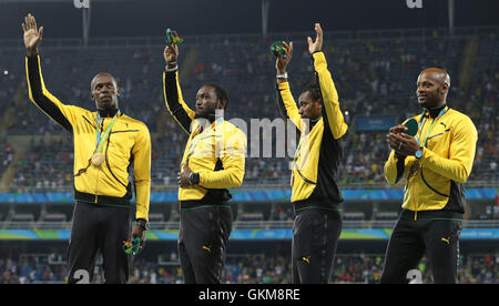 (From left to right) Jamaica's Usain Bolt, Nickel Ashmeade, Yohan Blake and Asafa Powell with their gold medals after victory in the the Men's 4 x 100m relay final at the Olympic Stadium on the fifteenth day of the Rio Olympic Games, Brazil. Stock Photo