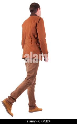 Back view of going  stylishly dressed man in a brown jacket.  walking young guy. Rear view people collection.  backside view of Stock Photo