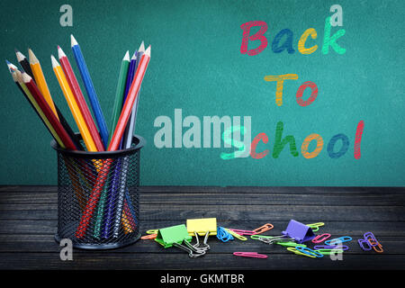 Back to school text on green board and group of pencils Stock Photo