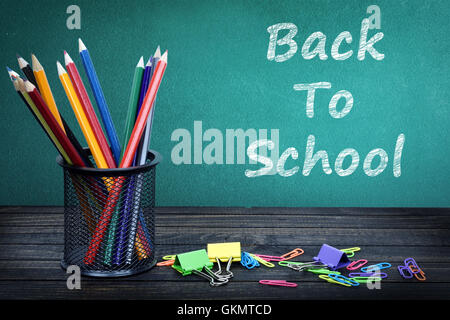 Back to school text on green board and group of pencils Stock Photo