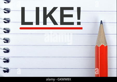 Like text on notepad and red pencil Stock Photo