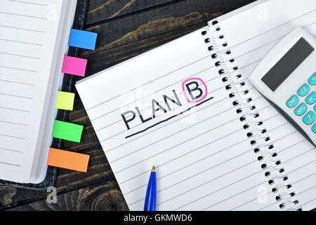Plan B text on notepad and hand calculator Stock Photo
