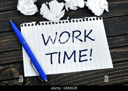 Work time on notepad and crippled paper Stock Photo