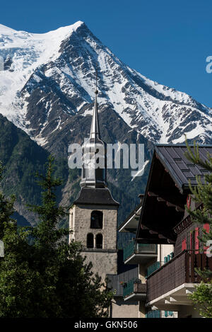 Eglise St-Michel at Chamonix and Aiguille du Gouter Stock Photo