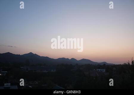 beautiful sunrise over outeniqua mountains in george western cape south africa early morning golden hour Stock Photo