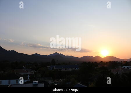 beautiful sunrise over outeniqua mountains in george western cape south africa early morning golden hour Stock Photo