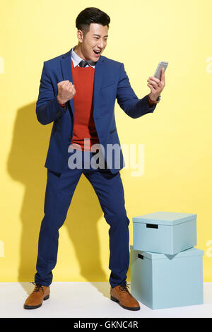 Excited young business man Stock Photo