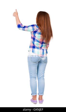 Back view woman thumbs up.girl in plaid shirt. Stock Photo