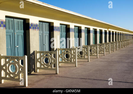 Doors to the beach cabins in Deauville and decorations with names of famous actors who have visited this famous resort Stock Photo