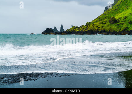 View of mount Reynisfjall and Famous Reynisdrangar rock formations at Back Beach in the Village of Vik Iceland Stock Photo