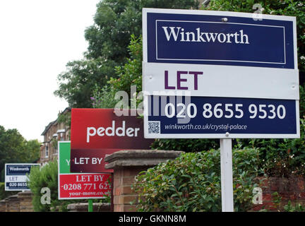 Estate agents 'Let' boards in street in Crystal Palace, South London. Stock Photo