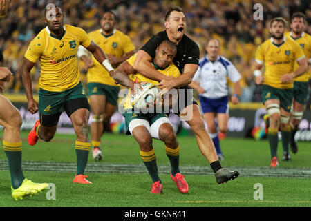 Sydney, Australia. 20th Aug, 2016. New Zealand's Israel Dagg (15) gets a penalty for a high tackle on Australia's Will Genia (9) during the first rugby union test match between Australian Wallabies and New Zealand All Blacks. New Zealand won the first match 42-8 at ANZ Stadium and 1-0 in the Bledisloe Cup annual three-match series Credit:  Hugh Peterswald/Pacific Press/Alamy Live News Stock Photo