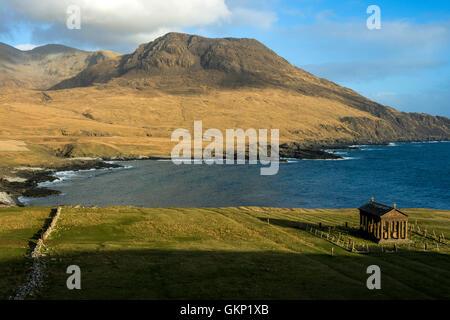 The Bullough Mausoleum and Ruinsival in the Rum Cuillin hills from Harris Bay, Isle of Rum, Scotland, UK. Stock Photo