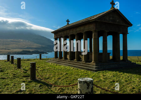 The Bullough Mausoleum with Ruinsival in the Rum Cuillin hills behind, Harris Bay, Isle of Rum, Scotland, UK. Stock Photo