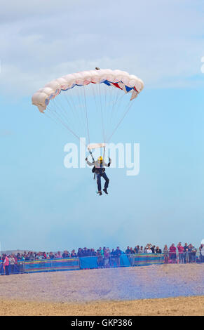 Bournemouth, UK. 21 Aug, 2016. The Tigers Freefall Parachute Team perform at Bournemouth Air Festival 2016 - crowds watch parachutists come into land. Credit:  Carolyn Jenkins/Alamy Live News Stock Photo