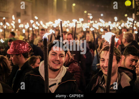 Bridport Torchlight Procession, Bridport, Dorset, UK. 21st Aug, 2016. Thousands of blazing torches were carried from Bridport's Bucky Doo Square to West Bay's East Cliff where music, fireworks and a giant bonfire helped celebrate the end of Bridport's Carnival week. The Bridport Carnival first started in 1911, was abandoned in 1920 then resurrected in 1971 and has been a popular annual event for locals and visitors since. Credit:  Tom Corban/Alamy Live News Stock Photo