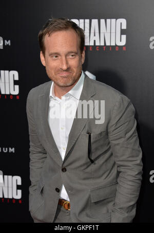 Los Angeles, USA. 22nd Aug, 2016. LOS ANGELES, CA. August 22, 2016: Screenwriter Tony Mosha at the Los Angeles premiere of 'Mechanic: Resurrection' at the Arclight Theatre, Hollywood. Picture Credit:  Sarah Stewart/Alamy Live News Stock Photo