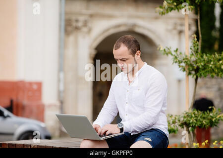 Photographer working on a laptop Stock Photo
