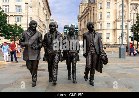 Bronze statue of the four Liverpool Beatles stands on Liverpool Waterfront by sculpture Andrew Edwards. Stock Photo