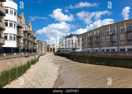 Old shipping warehouses on the Thames converted into residential apartment buildings, Canary Wharf / Limehouse, London, UK Stock Photo
