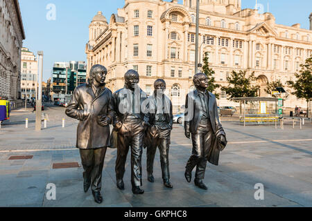 Bronze statue of the four Liverpool Beatles stands on Liverpool Waterfront by sculpture Andrew Edwards. Stock Photo