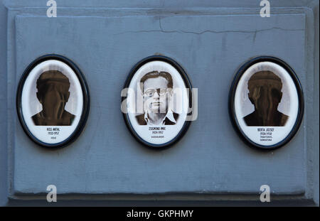 Portraits of the victims of the communist regime outside the House of Terror Budapest, Hungary. Farmer Imre Zsigmond (1924-1957) is pictured at the middle while heater Antal Kiss (1933-1957), and soldier and truck driver Jozsef Berta (1934-1958) have no photographs. Stock Photo