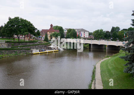 Bridge crossing the Cass River in Frankenmuth, Michigan. Shops across the river specialize in souvenirs for tourists. Stock Photo