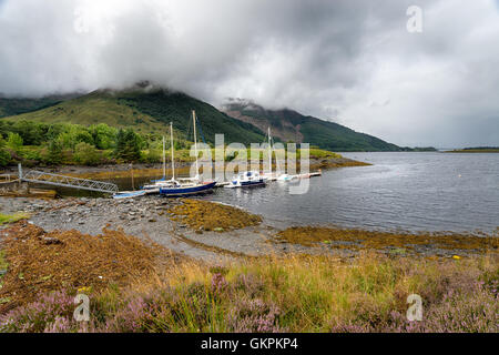 Boats at Loch Leven near Glencoe village in the Scottish highlands Stock Photo