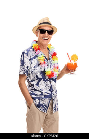 Happy senior tourist holding a cocktail isolated on white background Stock Photo