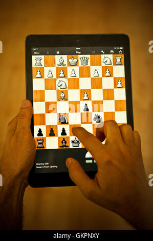 playing chess on iPad tablet Stock Photo