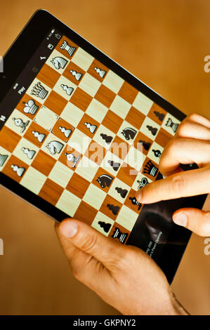 playing chess on iPad tablet Stock Photo