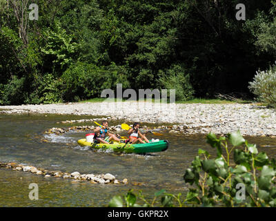 Couple making a canoe trip, a very popular activity in France, this is the Herault river in the Cevennes region. Stock Photo