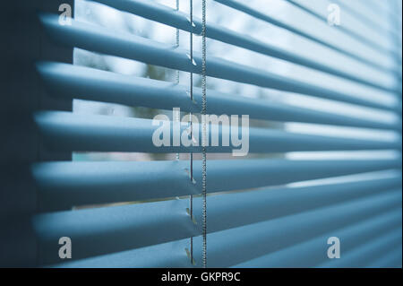 closed plastic blinds on the window with the reflection Stock Photo