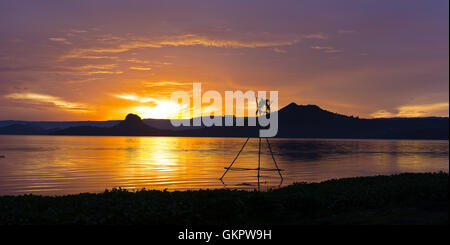 Tropical golden sunset on the Lake Taal, Luzon Island, Philippines. Stock Photo