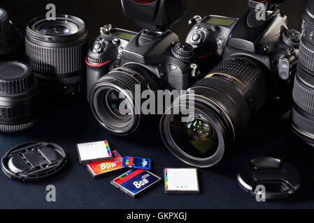 Set of photographs. DSLR camera, lens and flash cards Stock Photo