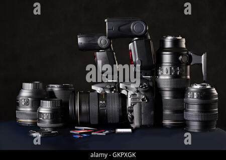 Set of photographs. DSLR camera, lens and flash cards Stock Photo