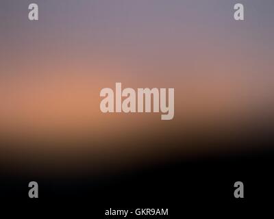 Blurred mesh gradient background black, orange and violet Stock Vector