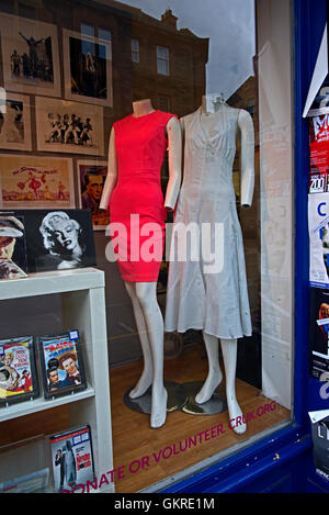 Headless and handless mannequins in the window of an Edinburgh charity shop. Stock Photo