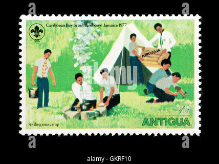 Postage stamp from Antigua depicting Boy Scouts setting up camp, issued for the 1977 Caribbean Scouting Jamboree in Jamaica. Stock Photo