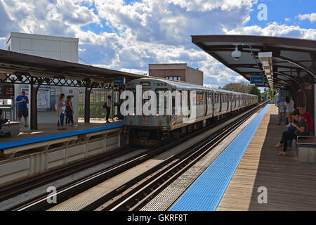 A south bound El train arrives at the CTA Southport station platform on the Brown Line in Chicago. Stock Photo