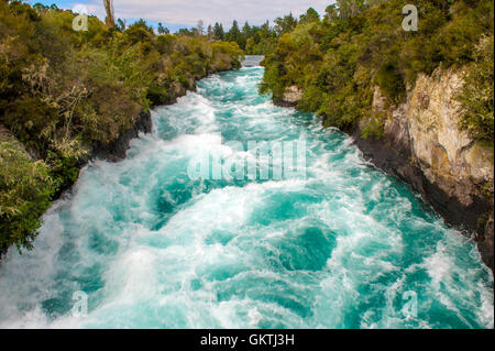 The Huka Falls are a set of waterfalls on the Waikato River that drains Lake Taupo in New Zealand. Stock Photo