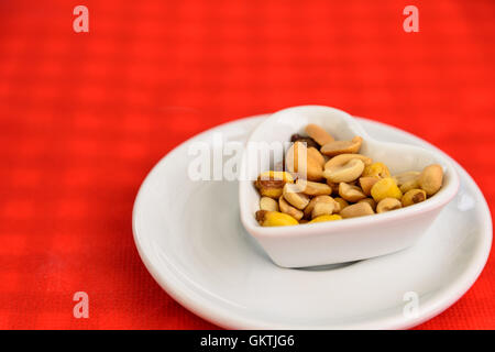 Heart Shaped Bowl With Dried Hard Fruits And Peanuts Stock Photo