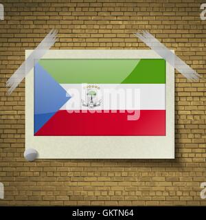 Flags Equatorial Guinea at frame on a brick background. Vector Stock Vector