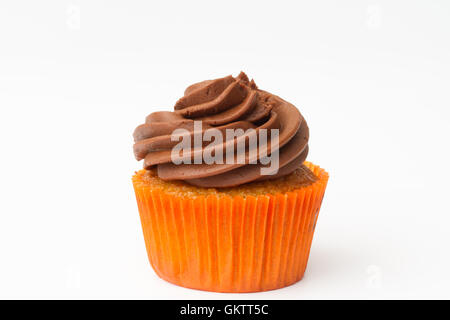 A chocolate orange cupcake with swirled frosting on an isolated white background. Stock Photo