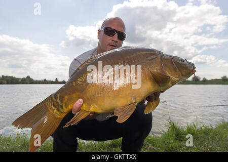 Happy Fisherman Holding a Beautiful Common Bream Stock Image - Image of  angler, person: 230641401