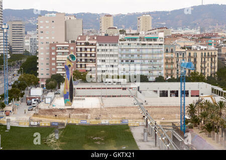 Dona i Ocell sculpture by Joan Miro in front of tower blocks near Placa D'Espanya, Barcelona, Spain Stock Photo