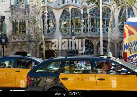 Taxis in front of Casa Batllo (Gaudi's House of Bones) on Passeig de Gràcia, Barcelona, Catalonia Stock Photo