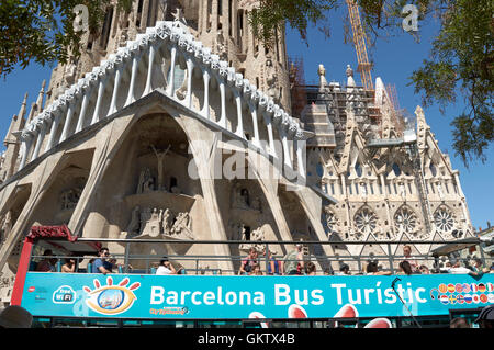 Barcelona Tour Bus outside the Antoni Gaudi church / cathedral (Sagrada Família), Barcelona, Catalonia, Spain Stock Photo